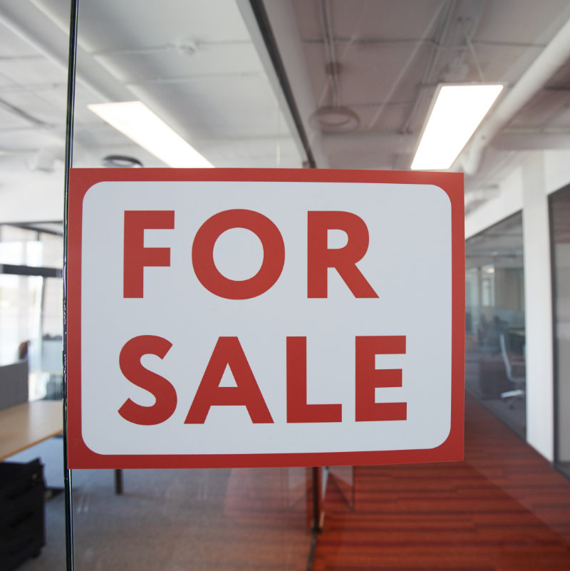 Graphic background image of red For sale sign on glass door of contemporary office space, copy space