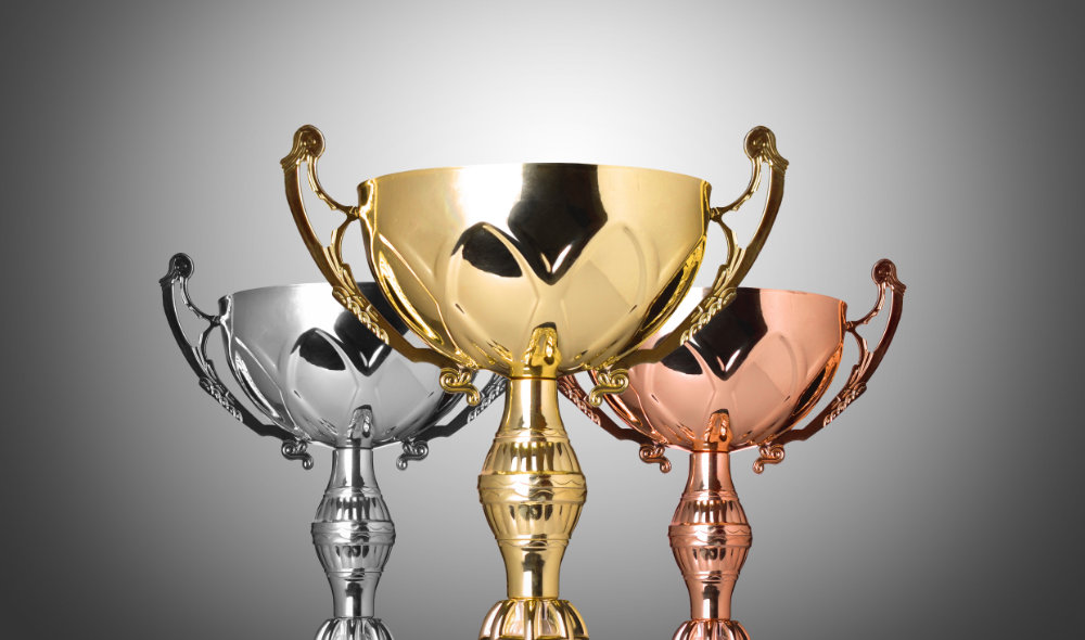 close up champion silver trophy on gray background